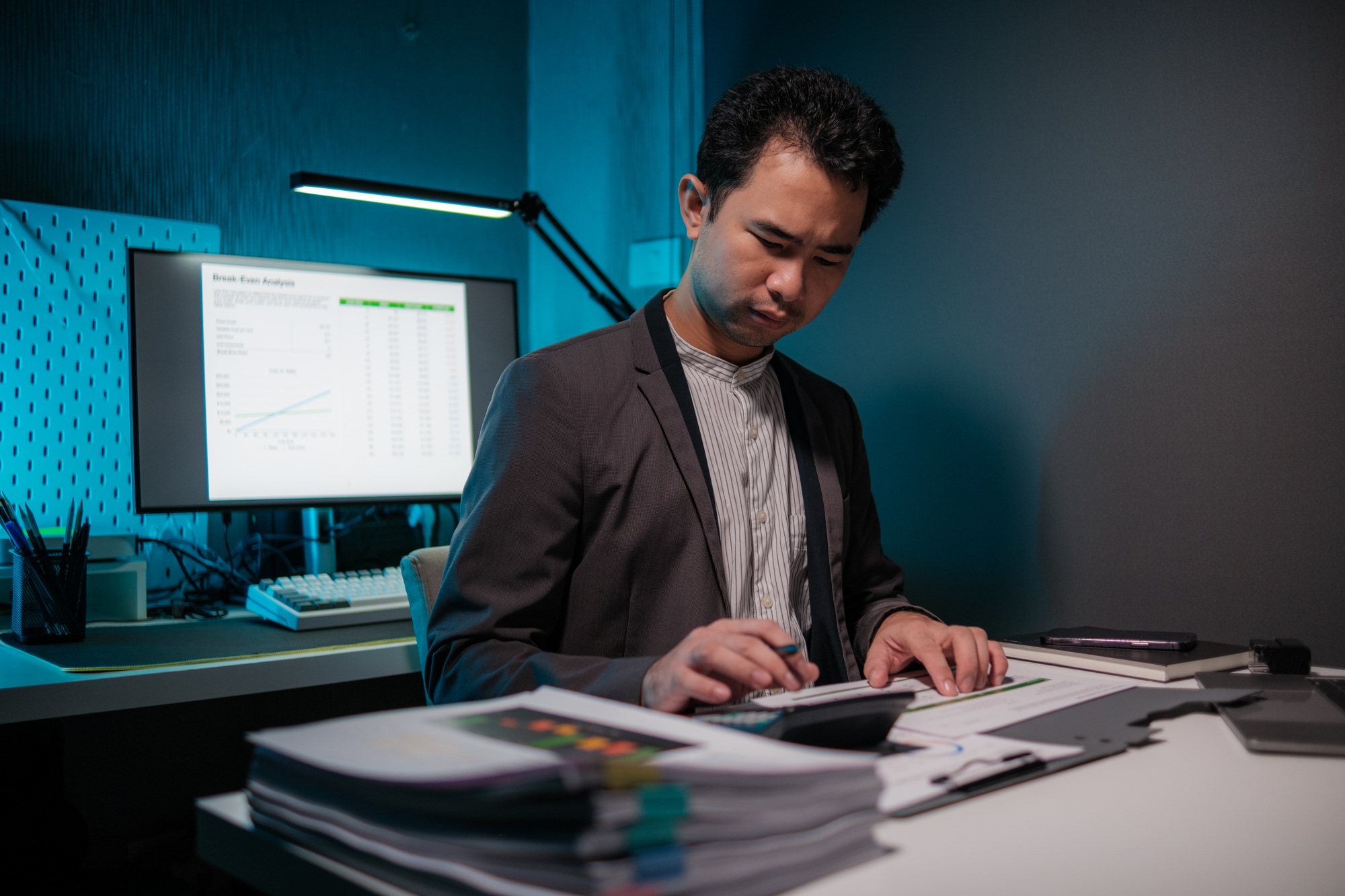 Businessman calculating business balance prepare tax reduction. Tax deduction planning concept