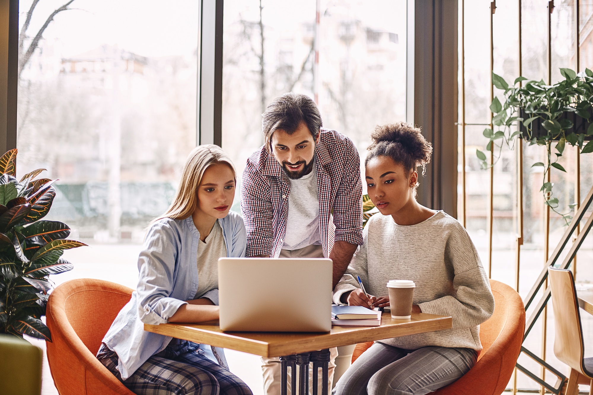 Nothing works better than just improving your product. Young design team working at desk in creative